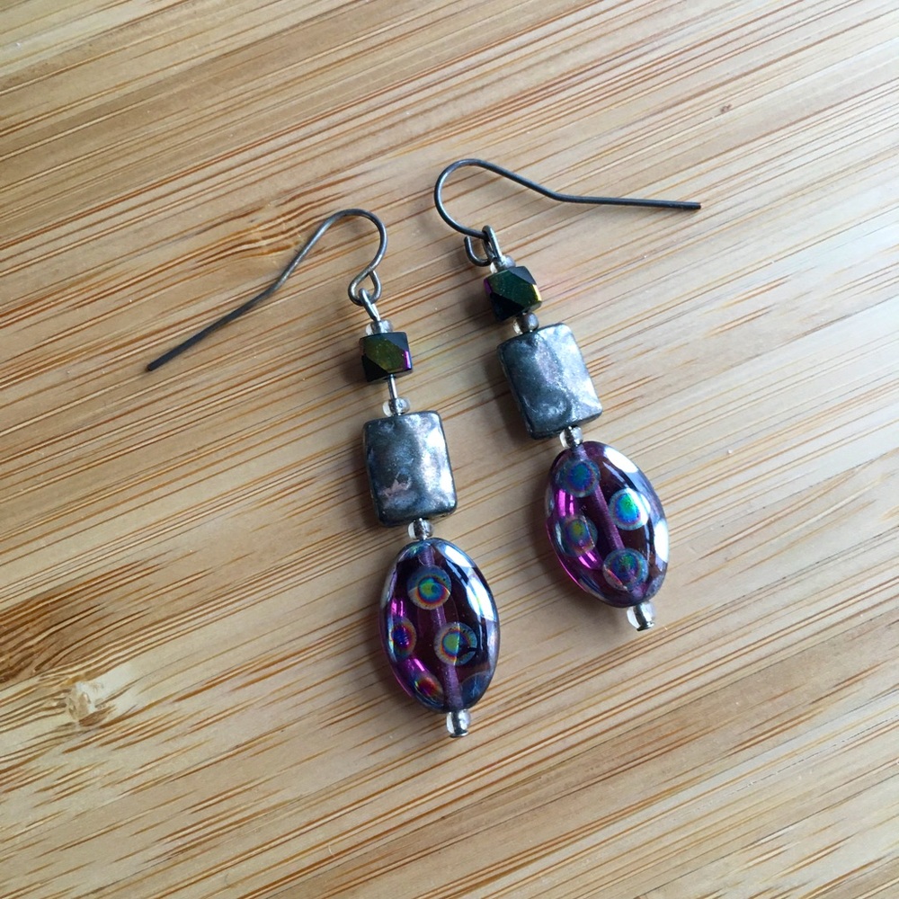 Iridescent purple dichroic glass drop earrings with peacock spot pattern